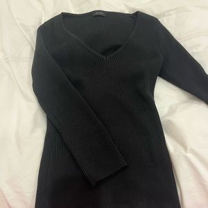 Black ribbed V neck sweater. NEVER WORN!!!!